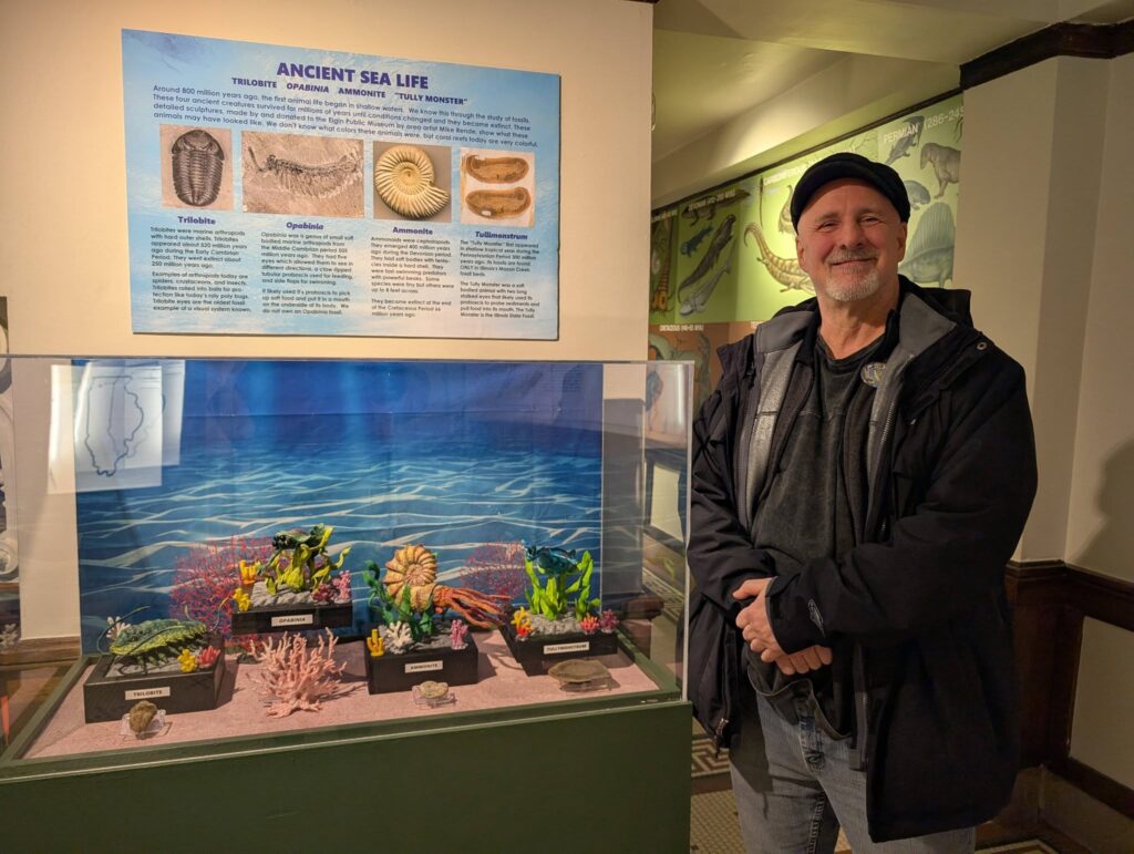 mike rende with the prehistoric creatures display in the elgin public museum 01